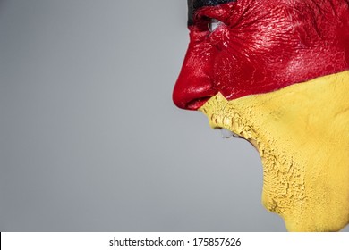 Soccer Fan With German Strip Flag Painted Over Face