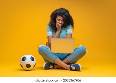 Soccer Fan Girl Sitting And Watching Play Live Broadcast Online On Her Laptop, Supporting Favourite Team, Biting Nails And Looking Upset About The Score.