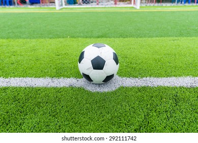 Soccer Field Grass With Ball At Kick Off Point.