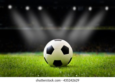 Soccer field and stadium with fans the night light. - Powered by Shutterstock