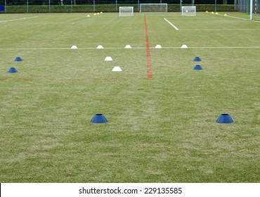 Soccer Field With Training Materials And Fence In Background