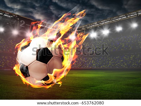 Soccer or football ball on fire at stadium
