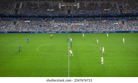 Soccer Football Championship Stadium with Crowd of Fans: Blue Team Starts The Game With Kick Off, Beginning of International Tournament Finals. Sport Channel Broadcast Television Concept. High Angle. - Shutterstock ID 2247676713