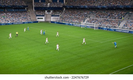 Soccer Football Championship Stadium with Crowd of Fans: Blue Team Forward Attacks, Dribbles, Players Defending The Goals, Ready To Counterattack. Sports Channel Broadcast Television. High Angle Wide. - Shutterstock ID 2247676729