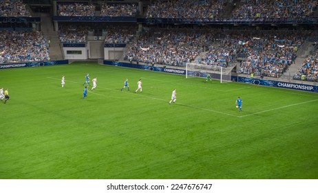 Soccer Football Championship Stadium with Crowd of Fans: Blue Team Attacks, Forward Dribbles, Players Defending The Goals, Ready To Counterattack. Sports Channel Broadcast Television. High Angle. - Shutterstock ID 2247676747