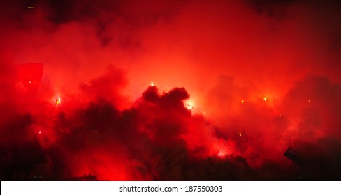 Soccer Or Football Fans Using Pyrotechnics