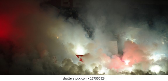 Soccer Or Football Fans Using Pyrotechnics