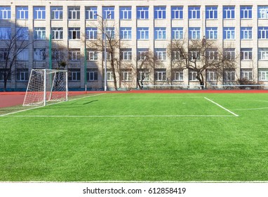 Soccer Football Field Near Urban School Building