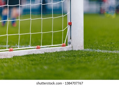 Soccer Football Goal With Net. Football Pitch Field With Fresh Green Grass. Soccer Low Angle Soccer Background With Copy Space