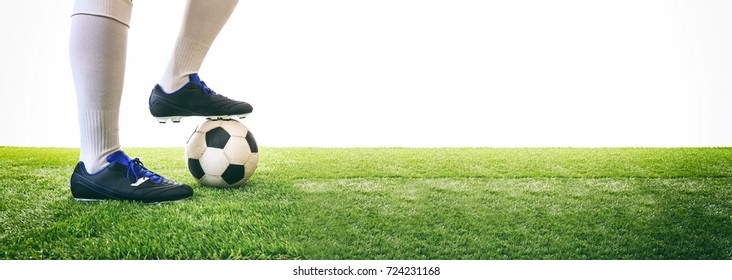 Soccer, Football Kick Off. Man Controls A Soccer Ball On The Grass. White Background And Copy Space