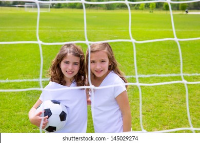 Soccer football kid girls playing on sports outdoor field - Powered by Shutterstock