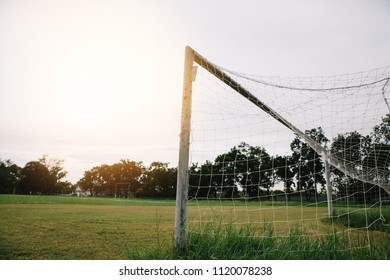 Soccer or football net background, view from behind the goal with blurred stadium and field pitch in thailand hi key - Shutterstock ID 1120078238