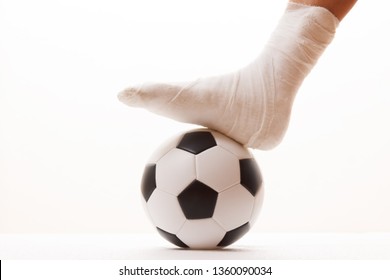 Soccer football player and sport plaster foot leg,  ball. - Powered by Shutterstock