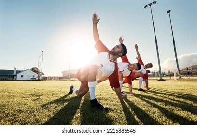 Soccer, football player and team stretching for sports match, training and practice of athlete men before game on outdoor field. Exercise, fitness and workout with male group ready for sport on grass - Powered by Shutterstock