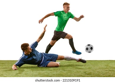 Soccer football players tackling for the ball on grass flooring over white background. Concept of sport, action, competition, football match. Athletes in action, movement at game. - Powered by Shutterstock