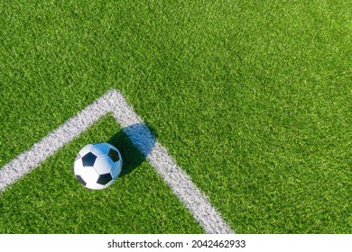 Soccer Football Sport Background. Soccer Ball On Green Artificial Grass Turf Field With White Line. Top View