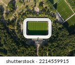 Soccer football stadium top down overhead Aerial in forrest park. Green grass landmark landscape architecture structure stands proffesional football club.