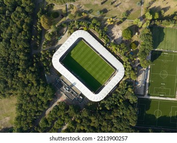 Soccer Football Stadium Top Down Overhead Aerial In Forrest Park. Green Grass Landmark Landscape Architecture Structure Stands Proffesional Football Club.