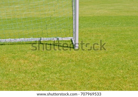 soccer gate post close up on green grass