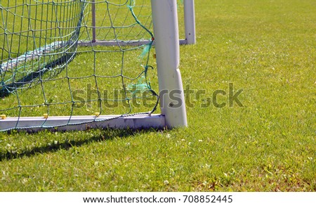 soccer gate post close up on green grass