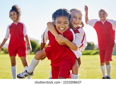 Soccer, girl celebration and field with happy piggyback, team building support and solidarity for winning game. Female kids, sports diversity and celebrate with friends, teamwork and goal in football - Powered by Shutterstock