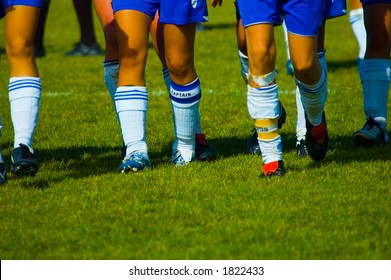 soccer girls legs with captain arm bands on legs - Powered by Shutterstock