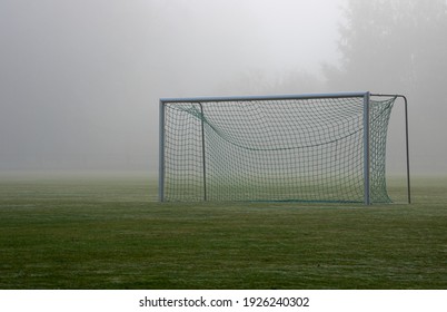 soccer goal in the field on a foggy day  - Powered by Shutterstock