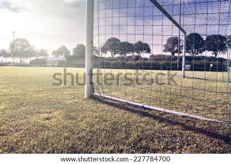 Soccer goal on summer field (football field)