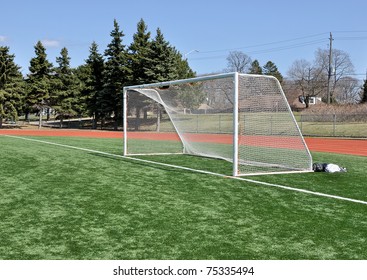 Soccer Goal Posts On Astroturf Field Under Blue Sky