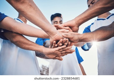 Soccer, hands together and teamwork, support and sports for training at stadium. Collaboration, group huddle and football players with motivation for exercise, workout goal or success in competition - Powered by Shutterstock