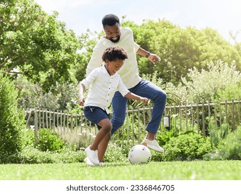 Soccer, happy dad and kid on a garden with exercise, sport learning and goal kick together. Lawn, fun game and black family with football on grass with youth, sports development and bonding on field - Powered by Shutterstock