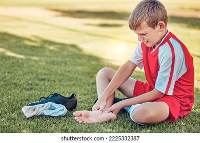 Soccer, Injury And Pain Of Child Foot On Field Cry For Medical Emergency, Healthcare Insurance And Wellness. Football, Soccer Field And Sad Kid Crying With Legs Massage For Sports Training Accident