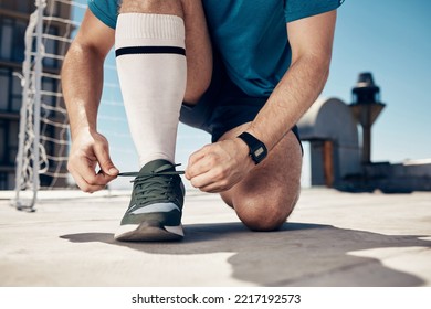 Soccer, Man And Tie Shoe For Training, Exercise And Workout On Concrete Court Before Sports Game And Match. Football, Fitness And Athlete Prepare Shoes For Cardio Sport Performance On Outdoor Court