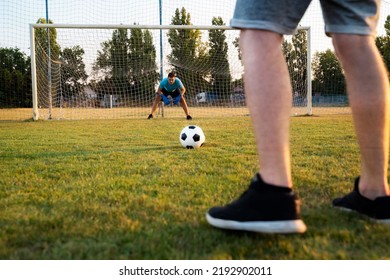 Soccer Penalty Shootout Concept, Two Men Playing Soccer. Unrecognizable Man Focused Before The Kick 