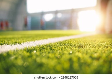 Soccer Pitch Background. Football Field Sideline at Sunny Day. Summer Day at Sports Field. Sunlight in the Background - Powered by Shutterstock