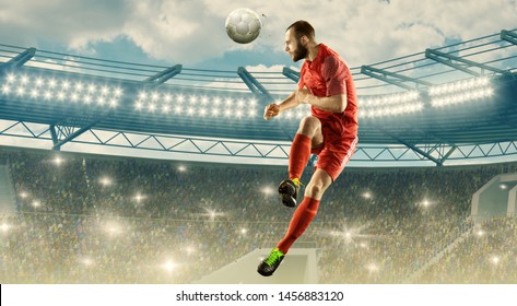 Soccer Player In Action. Flying Headed Shot. Soccer Stadium With Bright Lightning