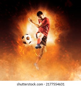 Soccer Player In Action On Fire Background