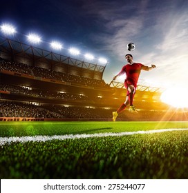 Soccer player in action on sunny stadium background