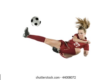 Soccer player in the air kicking the ball - Powered by Shutterstock