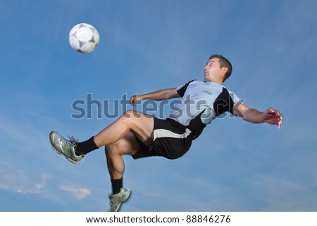 soccer player in a bicycle kick