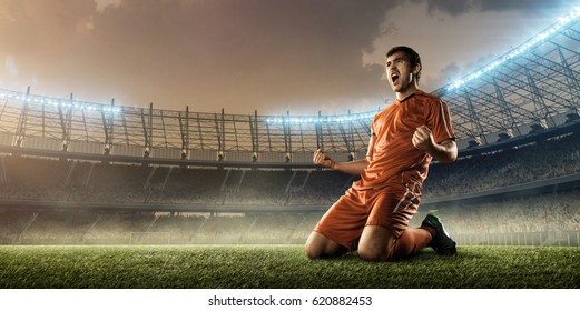 Soccer Player Celebrating Goal On A Soccer Stadium