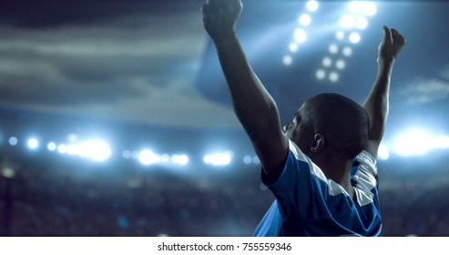 Soccer Player Is Celebrating Victory On The Soccer Stadium. He Wear Unbranded Sports Clothes. Stadium And Crowd Made In 3D.