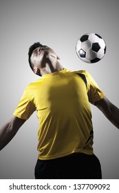 Soccer Player Chest Bumping A Ball