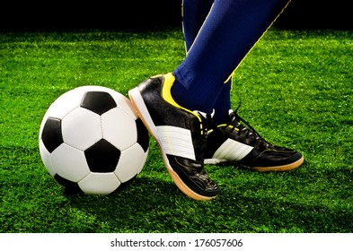 soccer player feet with ball closeup
