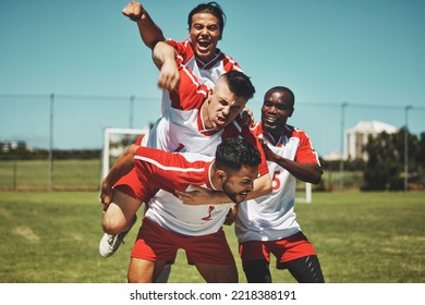 Soccer player, soccer and soccer field, winner and team, diversity and celebrate goal, athlete happy and sports win. Sport, fitness and young men celebrating, outdoor game and team spirit, piggy back - Powered by Shutterstock