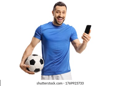 Soccer player holding a ball and a mobile phone and smiling at the camera isolated on white background - Powered by Shutterstock