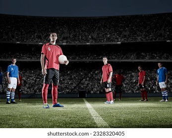 Soccer player holding ball on field - Powered by Shutterstock