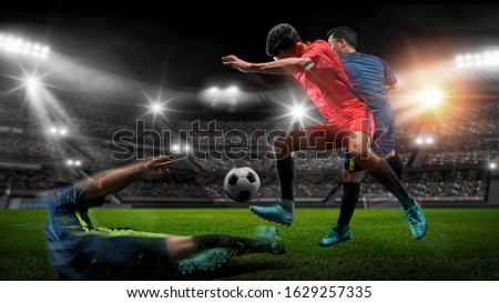 Soccer player kicks the ball on the soccer field.Professional soccer player in action.