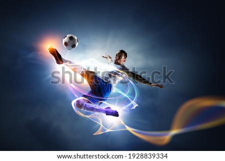 Soccer player on stadium in action. Mixed media