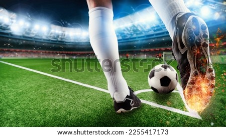 Soccer player ready to kick the soccerball at the stadium